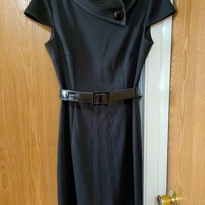 Knee length little black dress with belt and button details, stitched collar